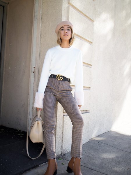 white sweater with light pink painter's hat and statement belt