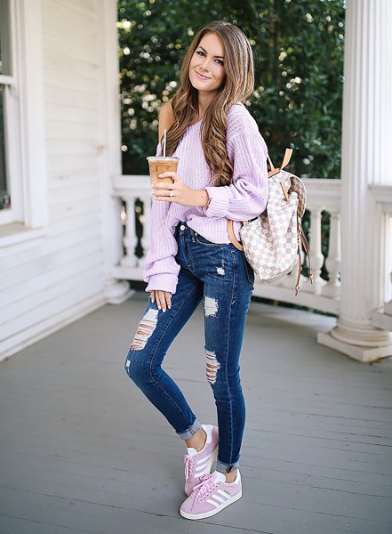 chunky ribbed lavender one shoulder sweater and blue jeans