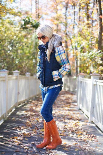 Check shirt with puffer vest and orange leather knee high boots
