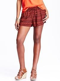 orange top with green mini shorts with tribal print