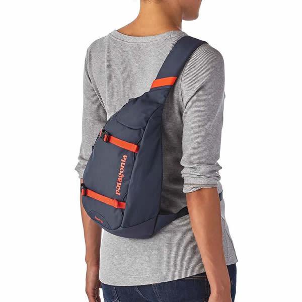 gray long-sleeved t-shirt with purple shoulder bag