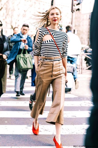 black and white striped cutout t-shirt and khaki flared suit pants