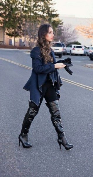 Dark blue sweater jacket with black leather over knee high boots