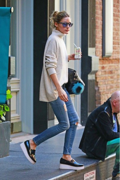 white mock-neck sweater with skinny jeans and black wedge leather sneakers