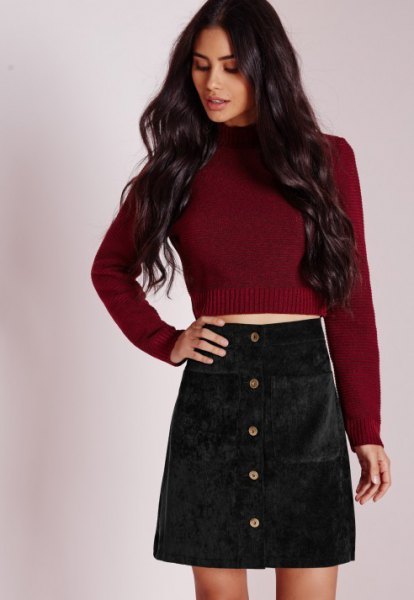 Burgundy knit sweater with black corduroy mini skirt