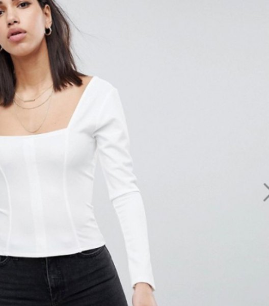 white long-sleeved top with black skinny jeans