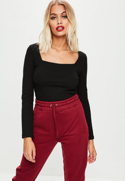 Black square neck long sleeve t-shirt paired with burgundy jogger pants