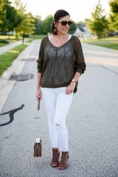 gray semi-sheer sweater with white slim-fit ankle jeans