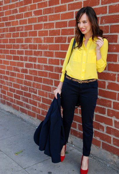 yellow button down shirt, black chinos and red heels