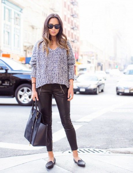 gray chunky v-neck sweater with leather leggings and slippers