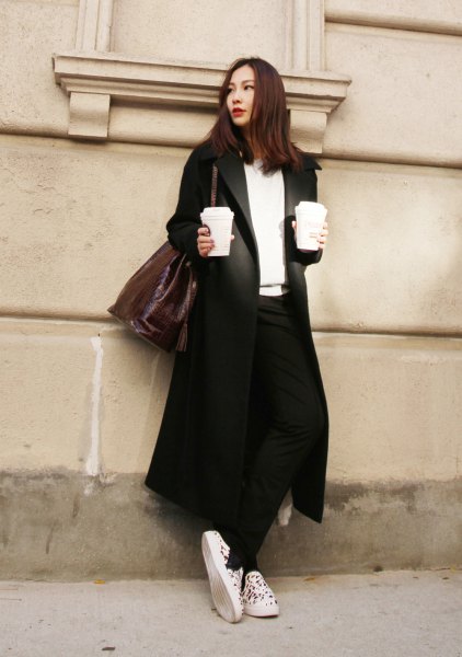 black longline blazer coat with white v-neck sweater and canvas sneakers