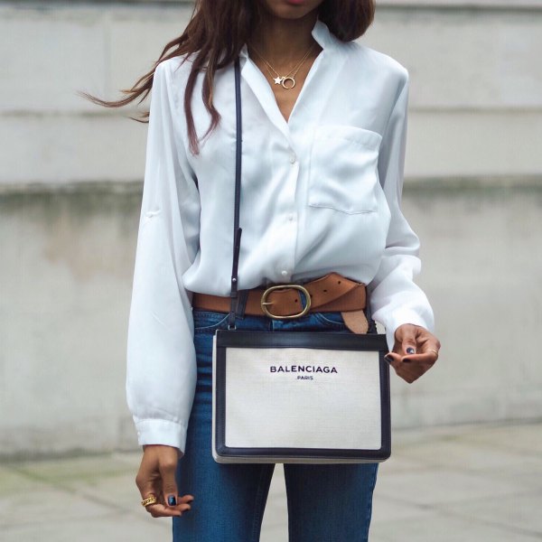 white silk button down shirt and blue high waisted jeans