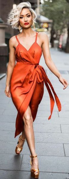 red satin wrap dress with gold heels