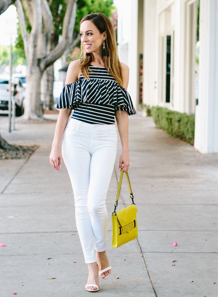 black and white striped top with cold shoulder ruffles and yellow leather handbag