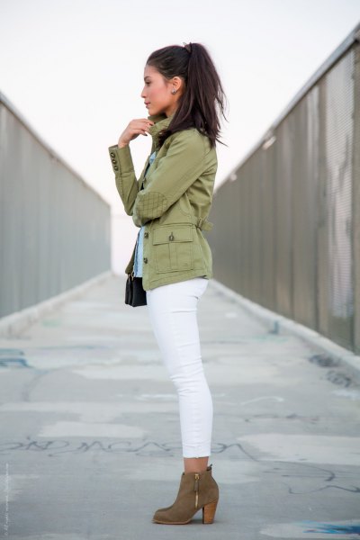Blush pink military jacket with white skinny jeans and camel boots