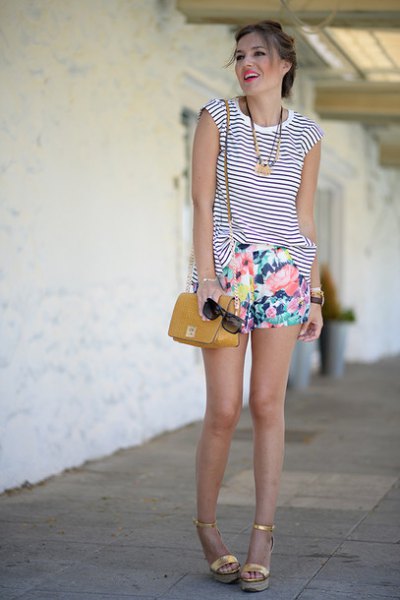 Sleeveless black and white striped tank top with floral print mini shorts