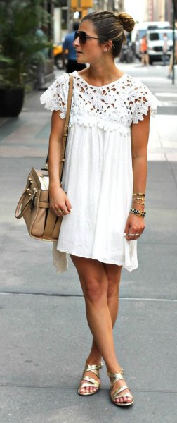White lace pleated swing mini dress with cap sleeves and gold strappy sandals