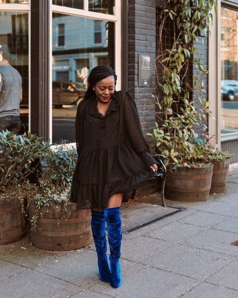 black mini ruffle long sleeve dress with blue velvet boots