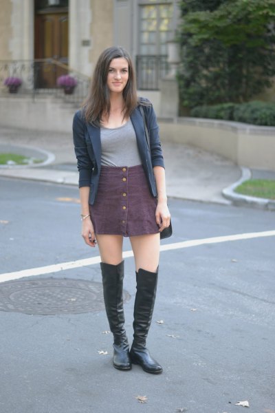 gray buttoned skirt over knee leather boots