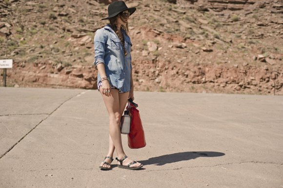 light blue buttoned chambray shirt and gray hiking sandals