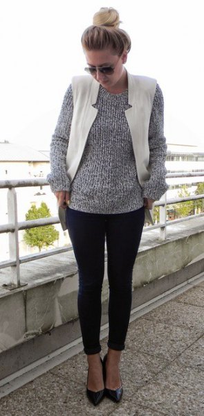 Gray mottled knit sweater with a round neckline, white waistcoat