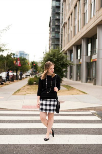 Three-quarter sleeve sweater, black and white checked mini skirt