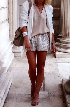 white blazer with a blush pink blouse and shiny shorts