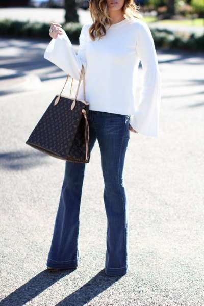 white bell sleeve blouse flare jeans outfit