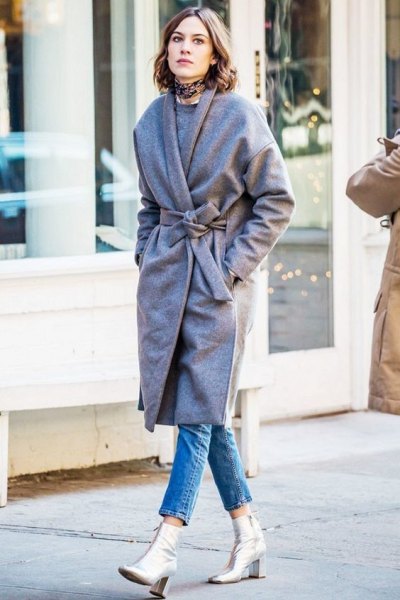 belted gray coat and silver leather boots