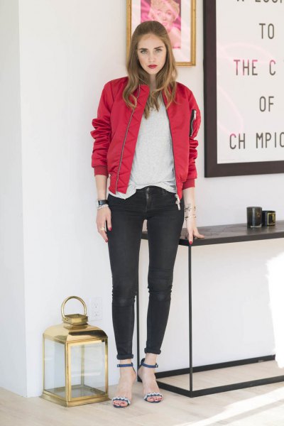 red bomber jacket with white t-shirt and black skinny jeans with cuffs