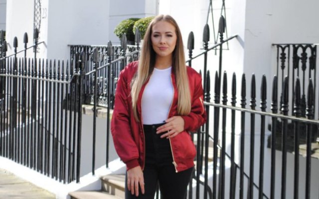 red jacket with white bodycon top and black high-waisted jeans