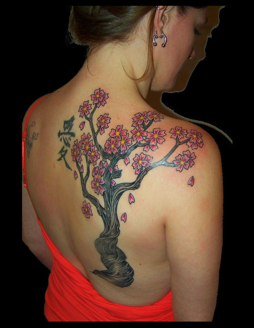 large plumeria tree tattoo on back