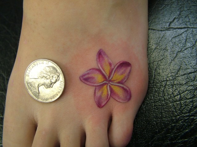 Plumeria tattoo on foot