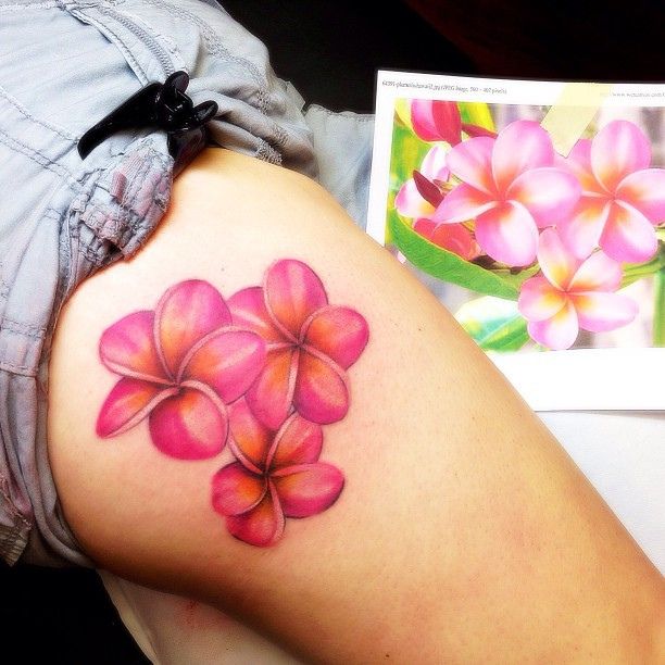 Plumeria tattoo on thigh