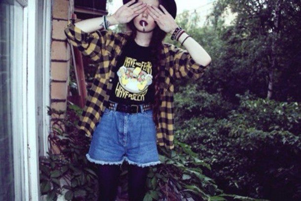 Pale yellow and black plaid shirt paired with flowy denim shorts