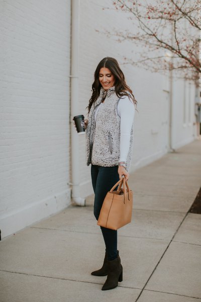 gray sherpa vest with white long sleeve turtleneck t-shirt