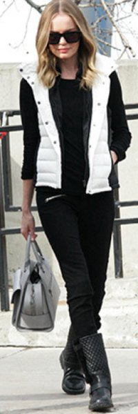 white hooded vest with black sweater and jeans