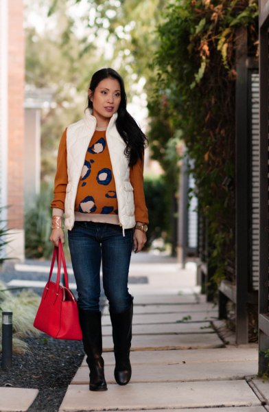 white puffer vest with red printed sweater