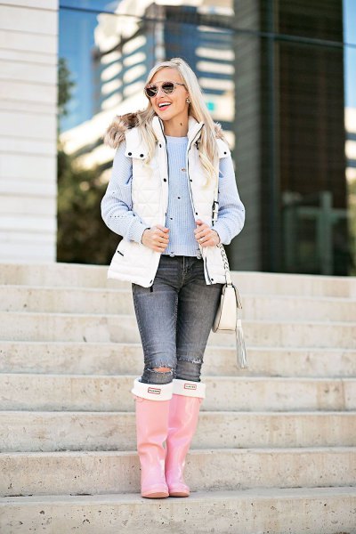 white puffer vest with faux fur collar hood over blue striped blouse