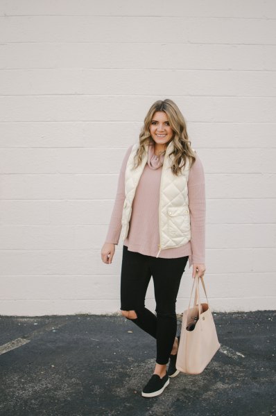 white quilted vest with light gray sweater and black jeans