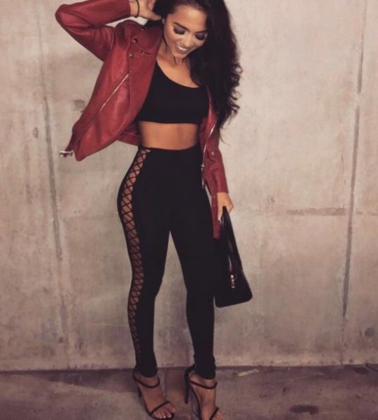 black crop top with red leather moto jacket and lace up pants