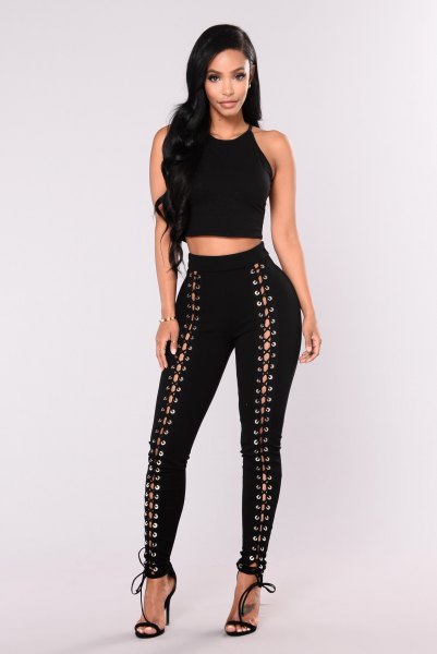 Crop top with black slim lace-up trousers and open toe heels