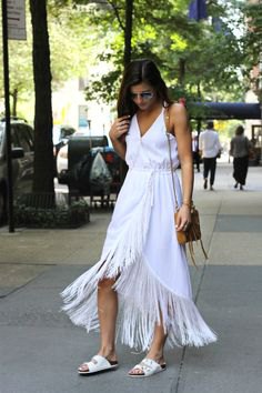 white wrap dress with maxi fringes and V-neckline