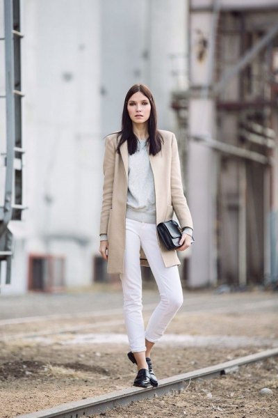 Blush pink long wool coat with white cuffed jeans