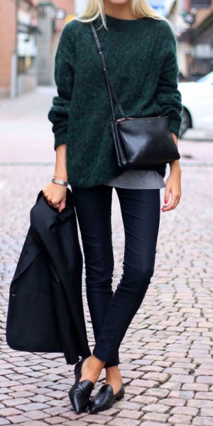 black, coarsely knitted sweater with dark jeans and leather low shoes