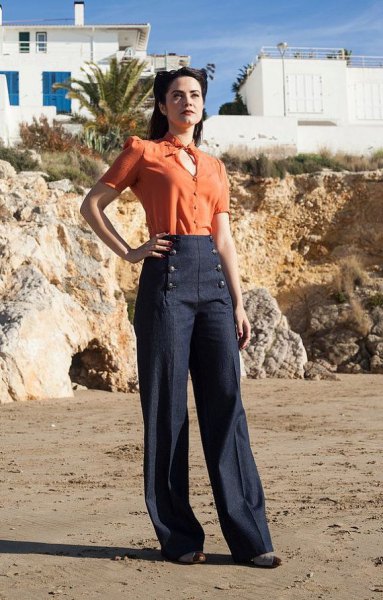 orange key hold blouse with dark blue sailor pants with wide legs