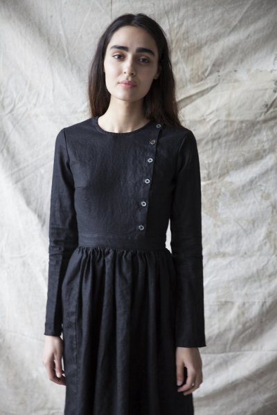 Airy linen dress with a black button on the front
