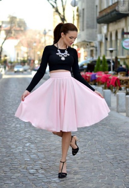 black cropped long sleeve t-shirt with light pink midi skirt