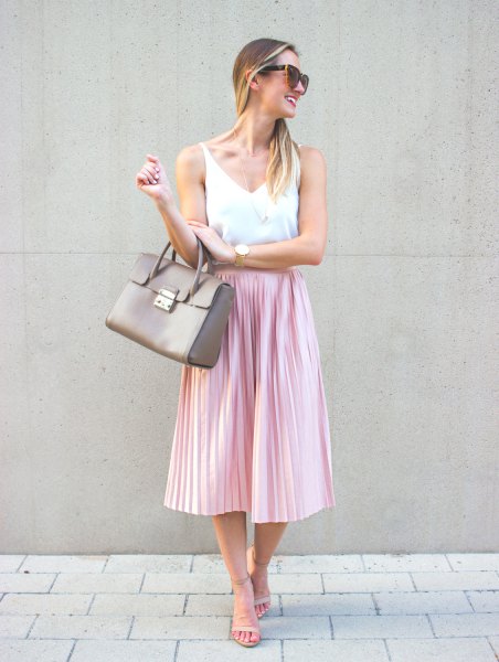 white V-neck tank top and pink silk pleated midi skirt