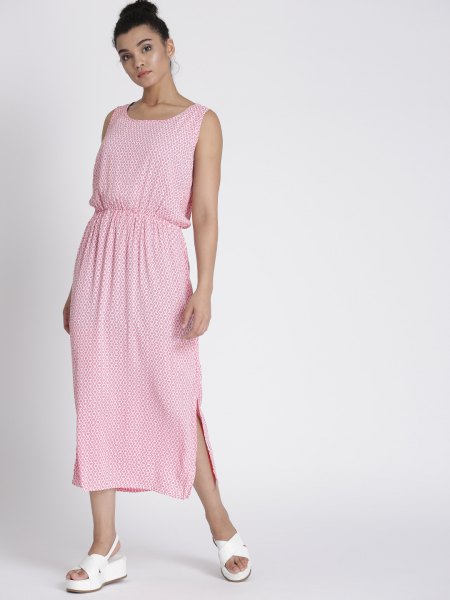 Light pink sleeveless maxi dress with gathered waist and white sandals